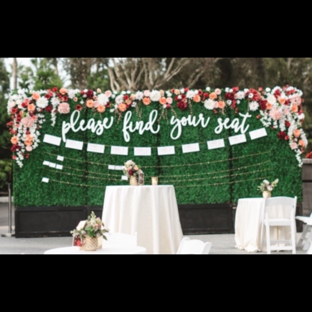 Variety of beautiful faux flowers & seat sign